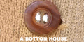 A BUTTON HOUSE logo